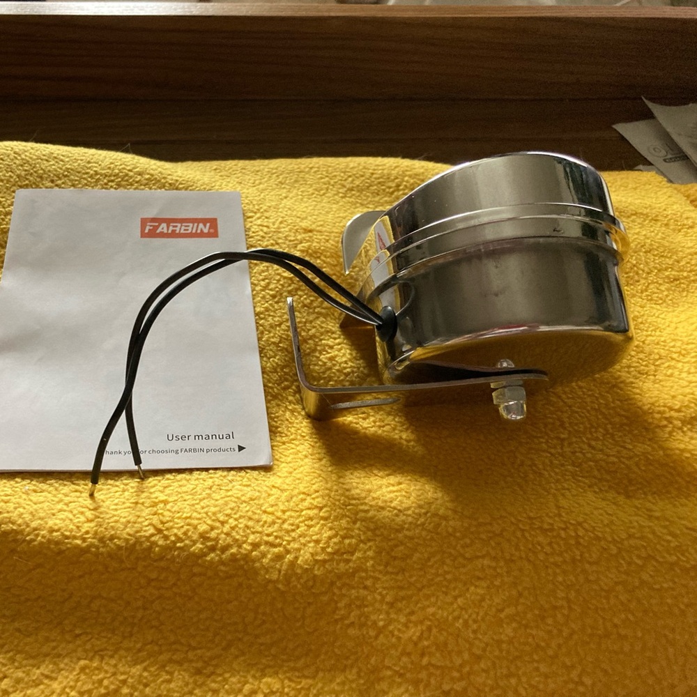 Stainless steel snail car horn.  NEW in original box.